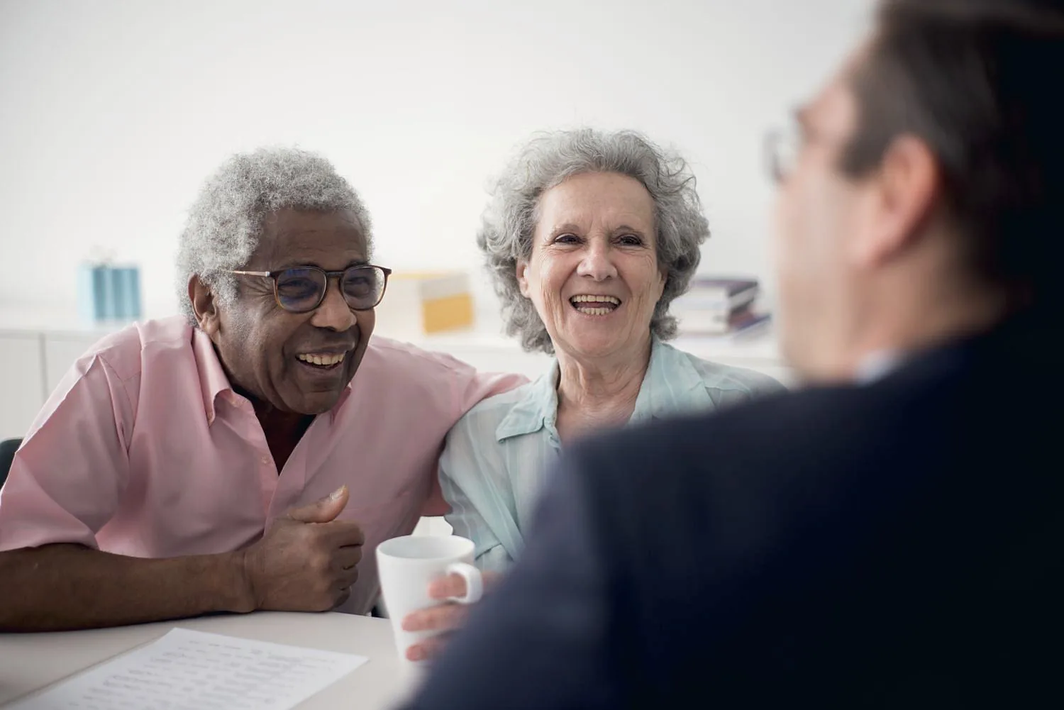 A licensed associate talking with an older couple