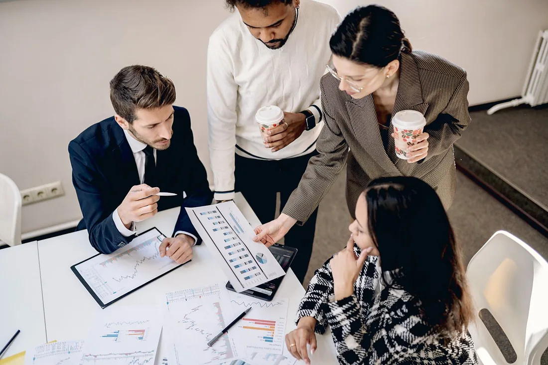 A diverse team of associates collaborating around a table